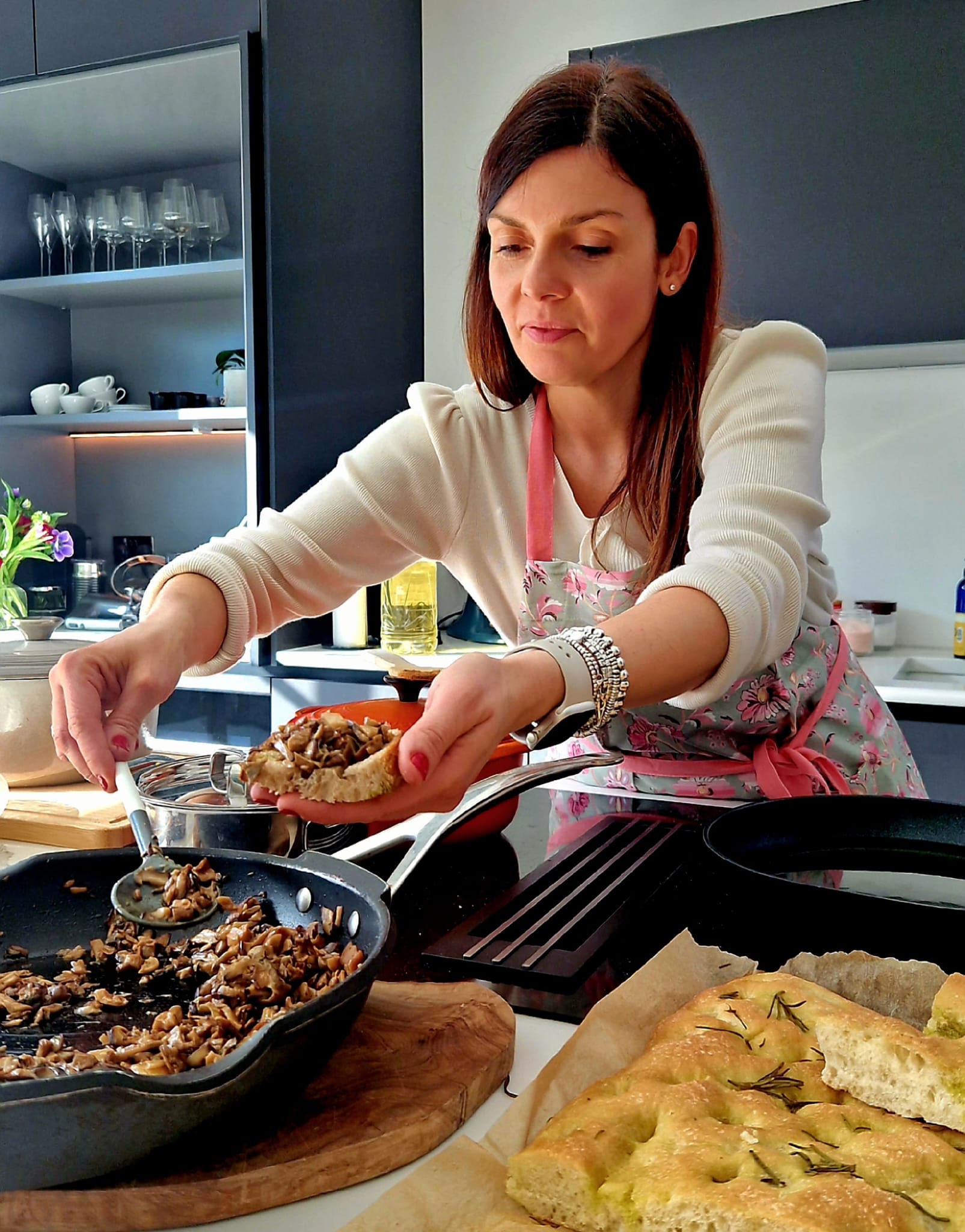 Ilaria plating mushroom crostini in her Dulwich kitchen